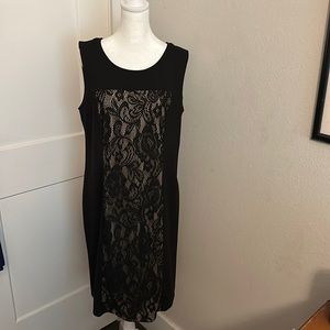 Black dress w/lace floral middle front & back. Tan liner